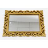 A large gilt frame rectangular wall mirror with pierced scroll border, 36” x 24¾” & three decorative