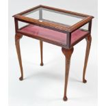 A late 19th/early 20th century inlaid mahogany bijouterie table enclosed by glazed hinged lift-lid &