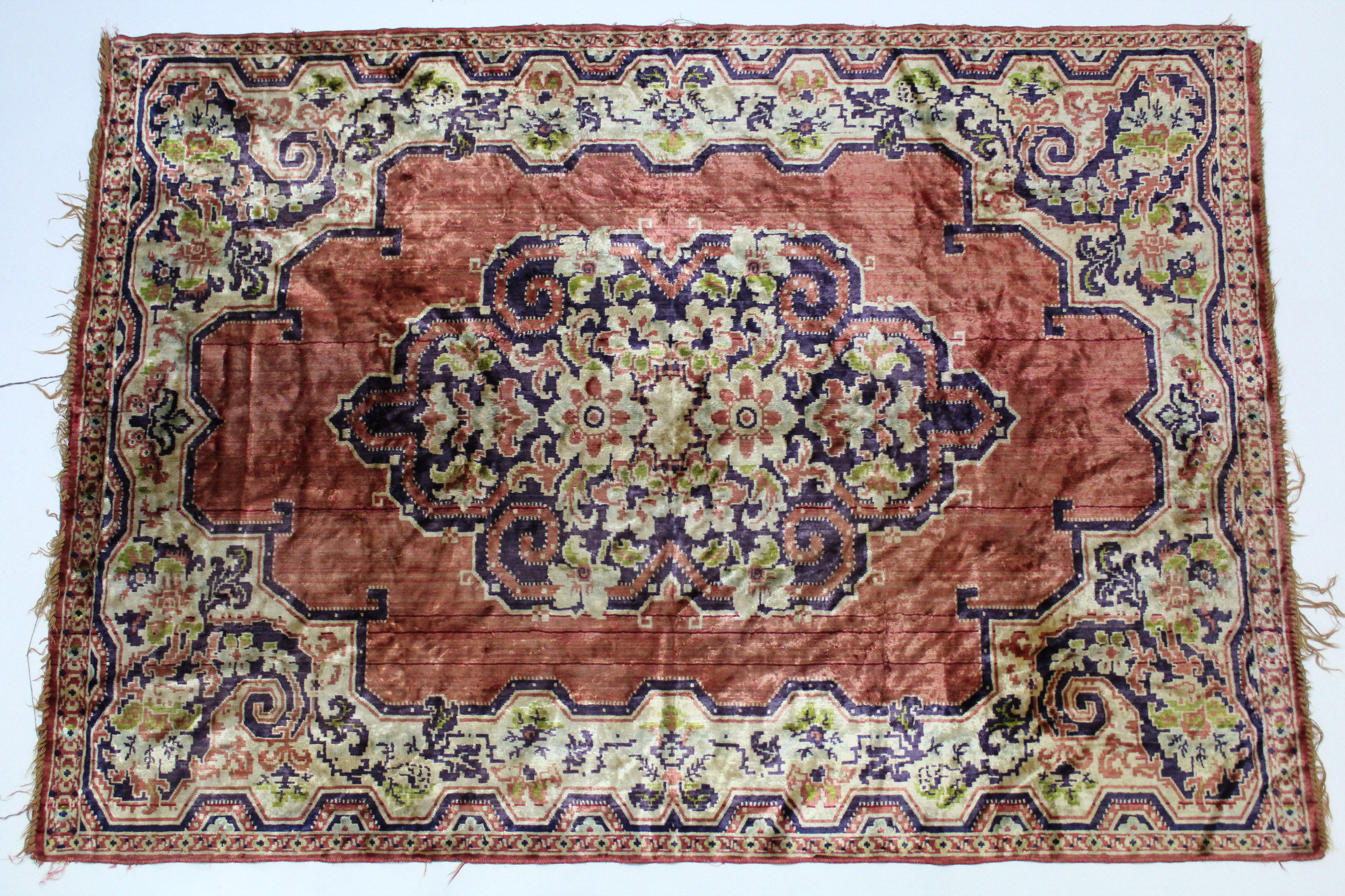 A silk rug of ivory & pink ground & with all-over multi-coloured floral design, 70” x 48”; & a