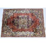 A silk rug of ivory & pink ground & with all-over multi-coloured floral design, 70” x 48”; & a