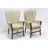 A pair of modern wing-back armchairs.