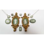 A pair of Wedgwood green & white jasperware small oval plaques in gilt ormolu frames, 2” x 1½”; &