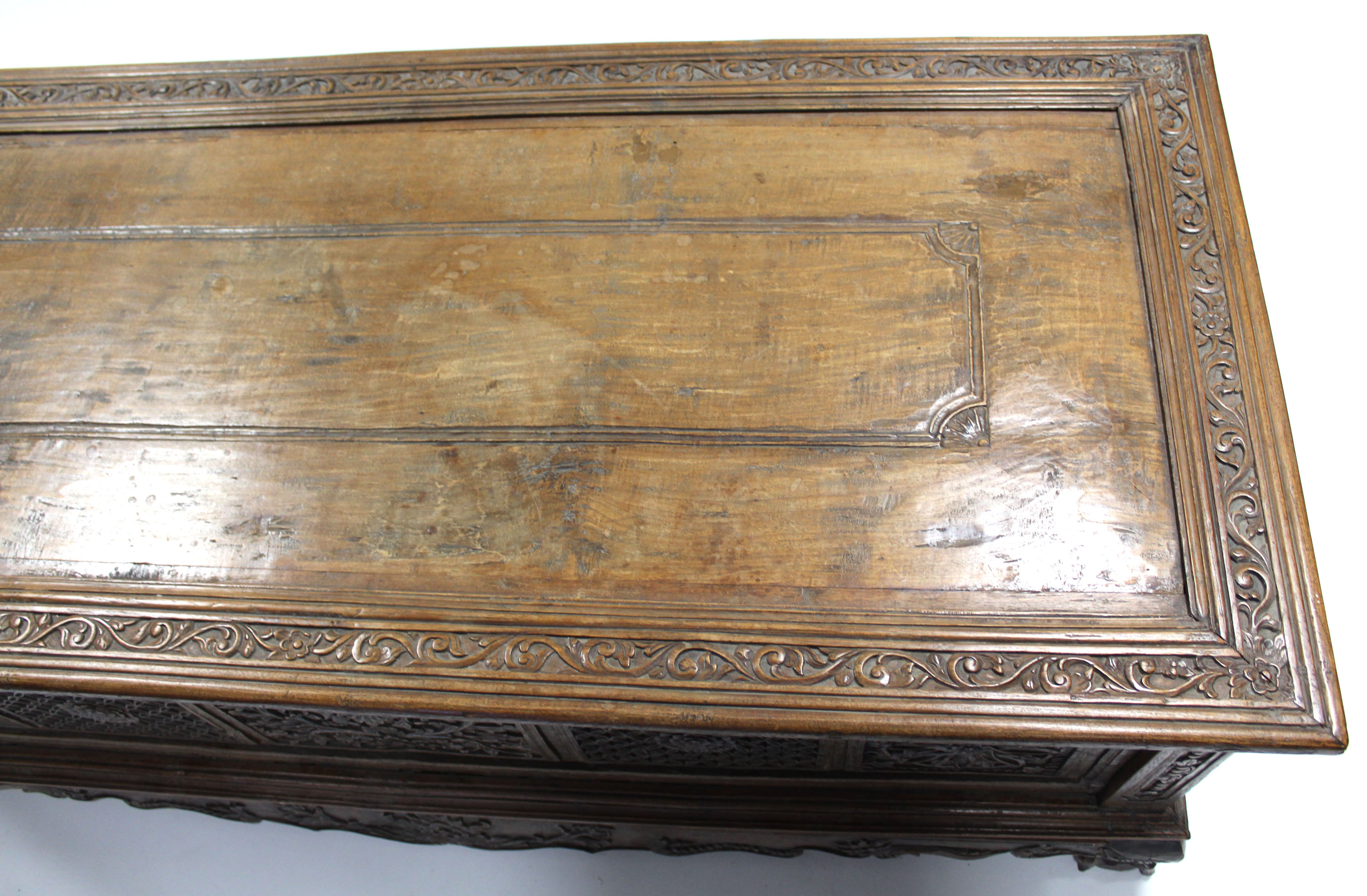 A 19th century INDONESIAN SOLID HARDWOOD CHEST, profusely carved to all sides with floral & - Image 11 of 11