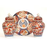 A pair of 19th century Japanese Imari baluster vases & covers with all-over foliate decoration, 12¾”