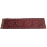 A Meshwari runner of dark blue ground with repeating geometric design; 23” wide x 95” long.