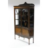 An Edwardian inlaid-mahogany tall china display cabinet fitted two shelves enclosed by pair of