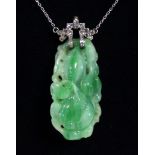 A 1920’s CHINESE JADE PENDANT of apple green-to-white colour, carved & pierced in the form of a