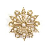 An Edwardian 15ct. gold star-shaped brooch set split pearls; Chester hallmarks for 1904. (3.7gm