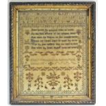 A 19th century needlework sampler by Mary Woolston, Aged 15, with alphabet, verse, trees &