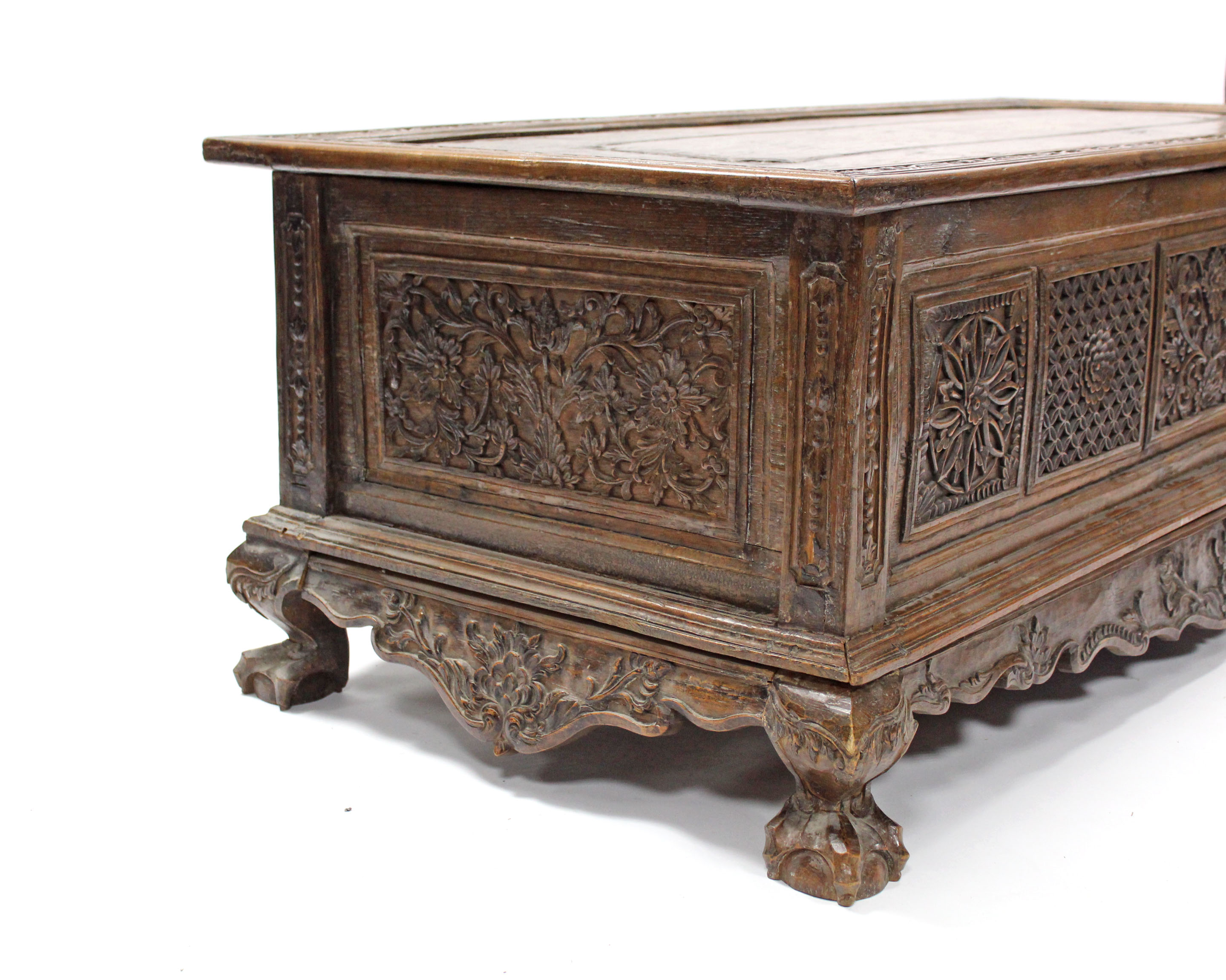 A 19th century INDONESIAN SOLID HARDWOOD CHEST, profusely carved to all sides with floral & - Image 7 of 11