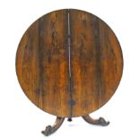 A mid-19th century rosewood centre table, the circular tilt-top on octagonal flared centre