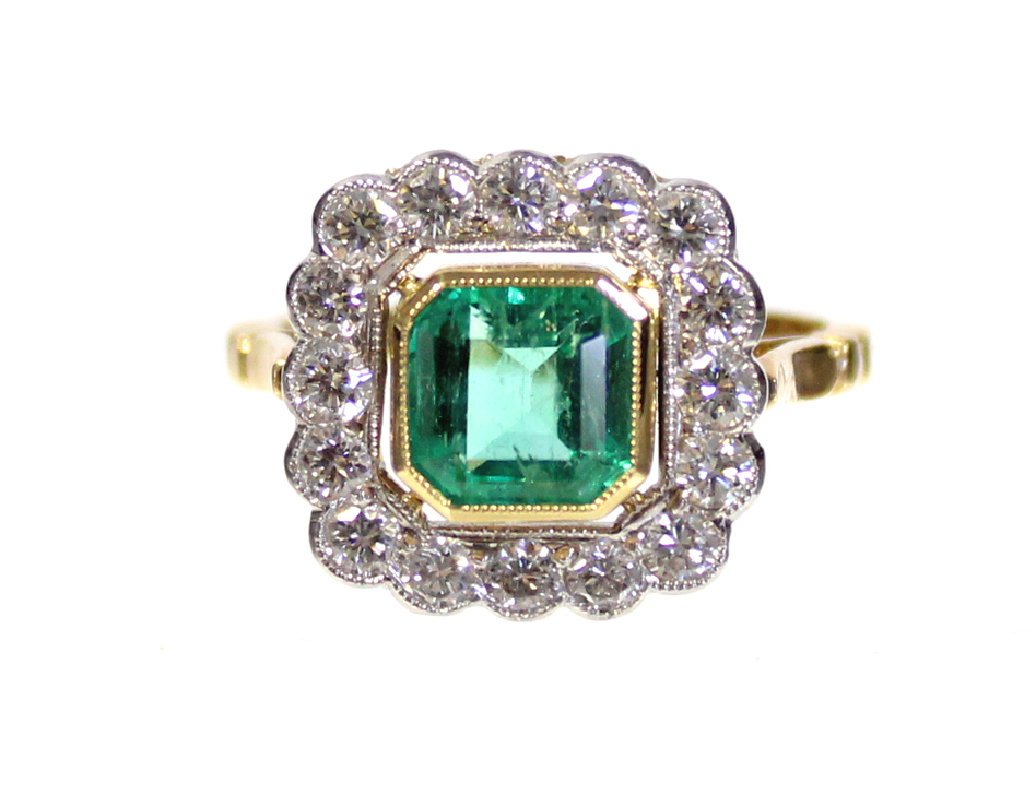 AN EMERALD & DIAMOND RING, the square-cut Columbian emerald weighing approximately 1.45 carats,