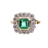 AN EMERALD & DIAMOND RING, the square-cut Columbian emerald weighing approximately 1.45 carats,