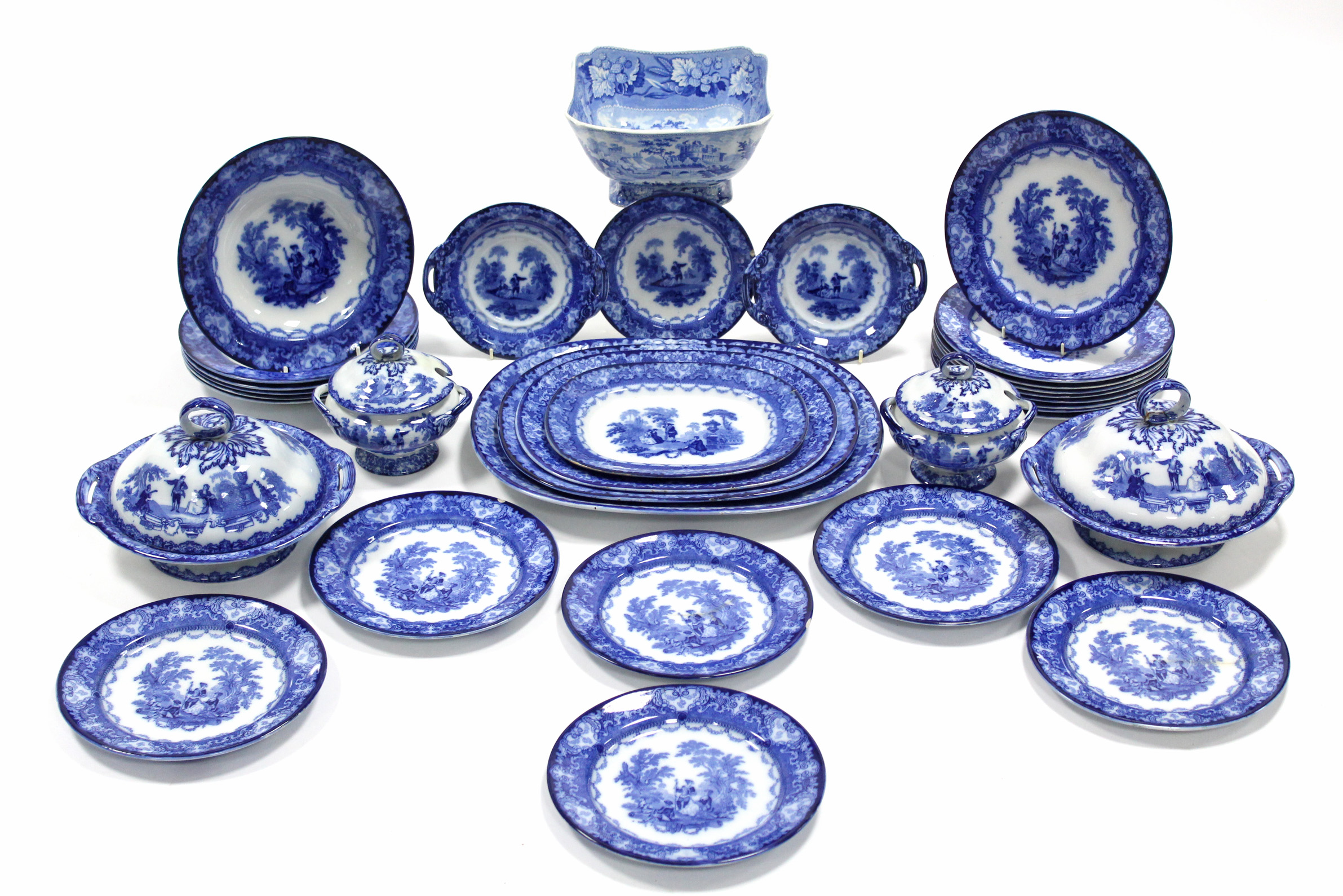 A Doulton Burslem ‘Watteau’ pattern blue transfer ware part dinner service comprising: four