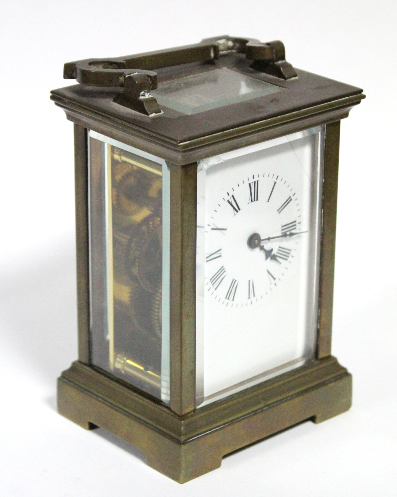 A brass carriage timepiece with black roman numerals to the white enamel dial; 4½” high. - Image 2 of 5