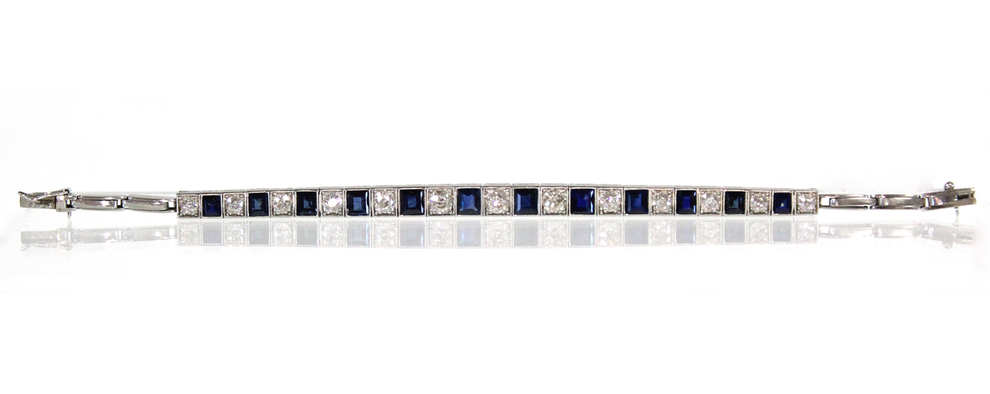 AN ART DECO PLATINUM, DIAMOND, & SAPPHIRE EXPANDING BRACELET, the thirteen graduated pavé-set - Image 2 of 7