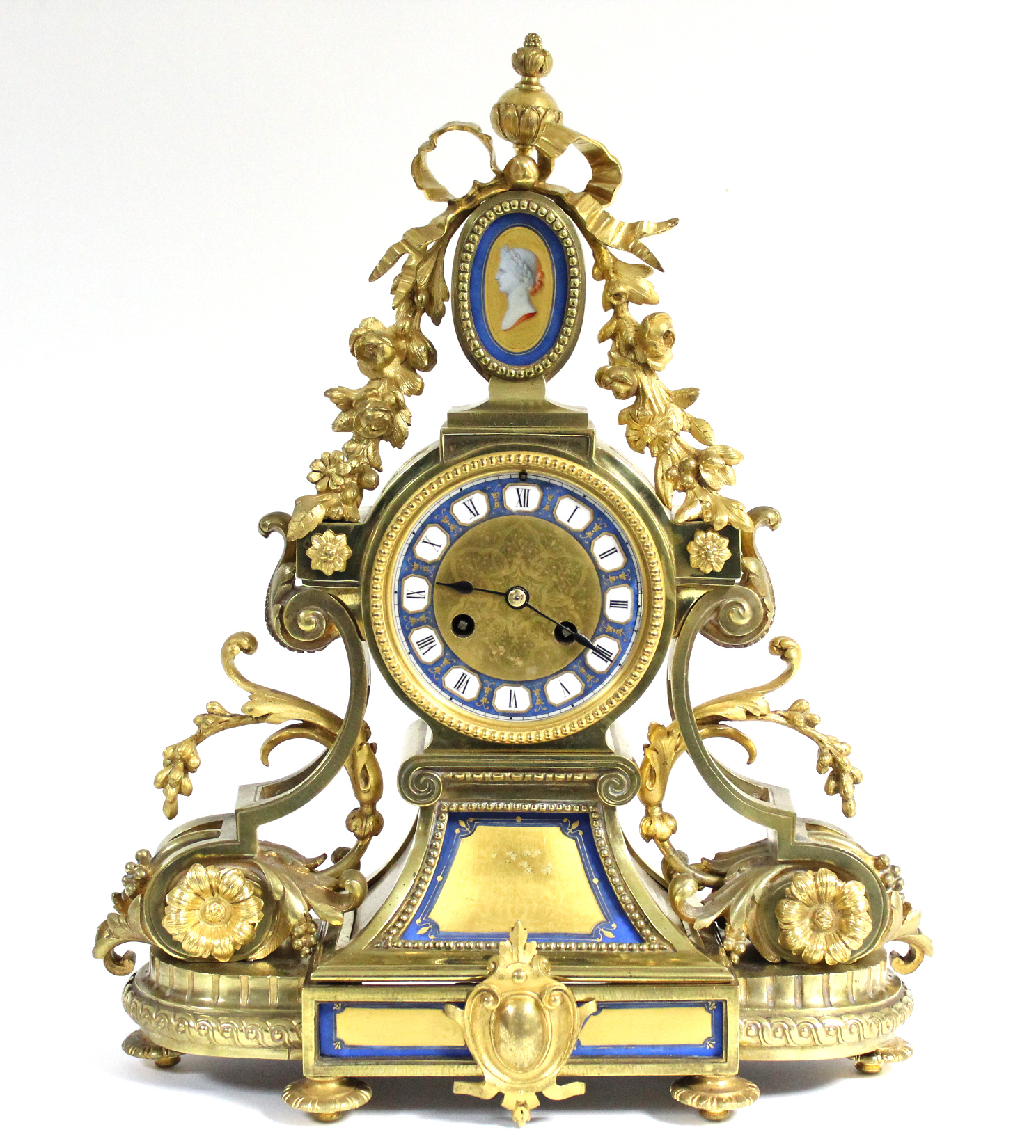 A mid-19th century French mantel clock in elaborate gilt brass case with pendant flowers & leaf-