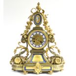 A mid-19th century French mantel clock in elaborate gilt brass case with pendant flowers & leaf-