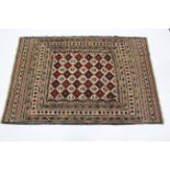 A needlework Sumak Kelim rug, of ivory ground with all-over geometric pattern in red, dark brown &