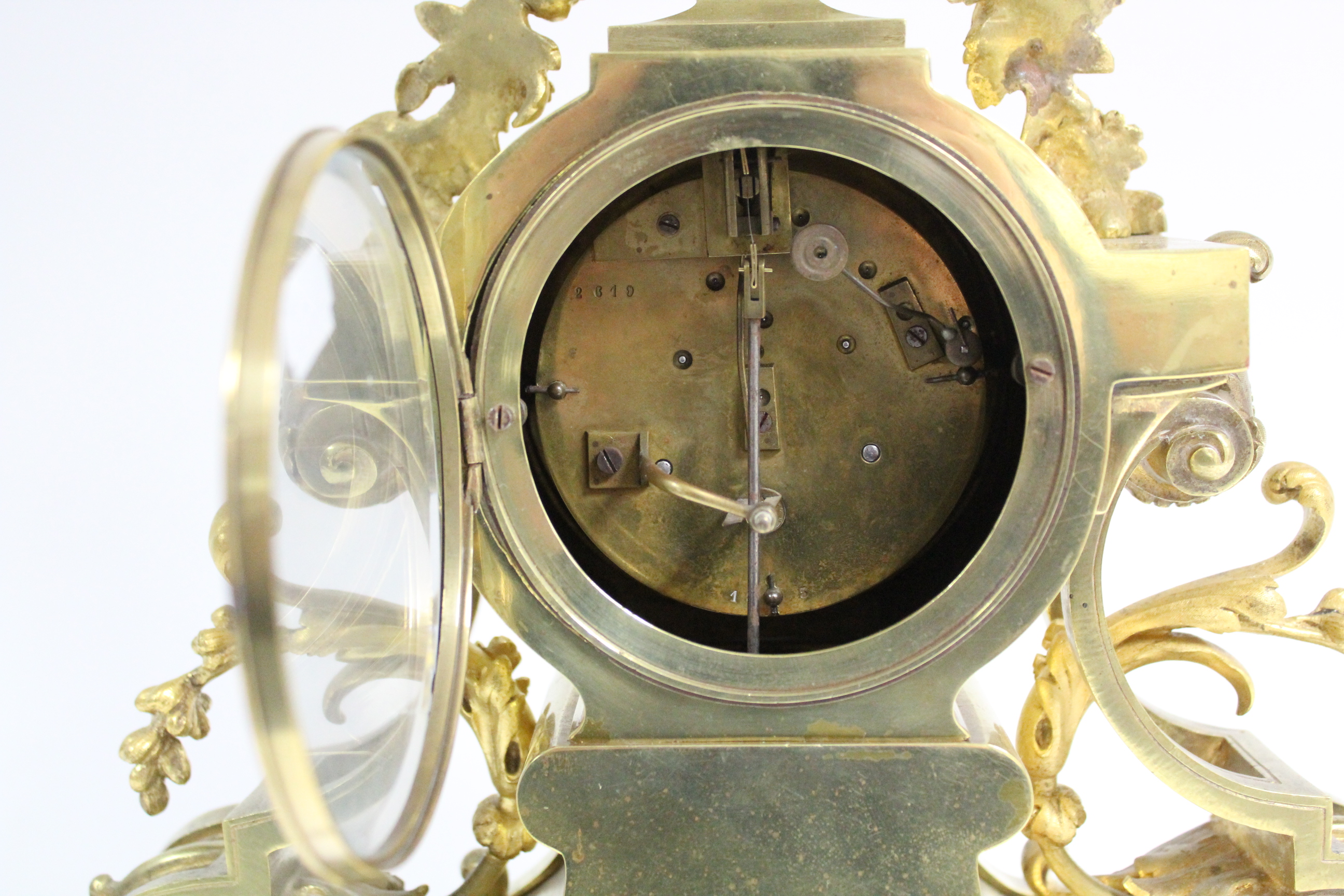 A mid-19th century French mantel clock in elaborate gilt brass case with pendant flowers & leaf- - Image 6 of 7