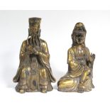 A pair of Chinese gilt bronze Buddhistic seated male & female figures, the male with seal mark to