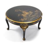 A black-lacquer circular low occasional table with gilt Chinoiserie decoration, on cabriole legs