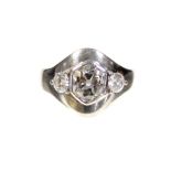 A THREE-STONE DIAMOND & PLATINUM RING, the hexagonal-cut collet-set centre stone weighing approx.