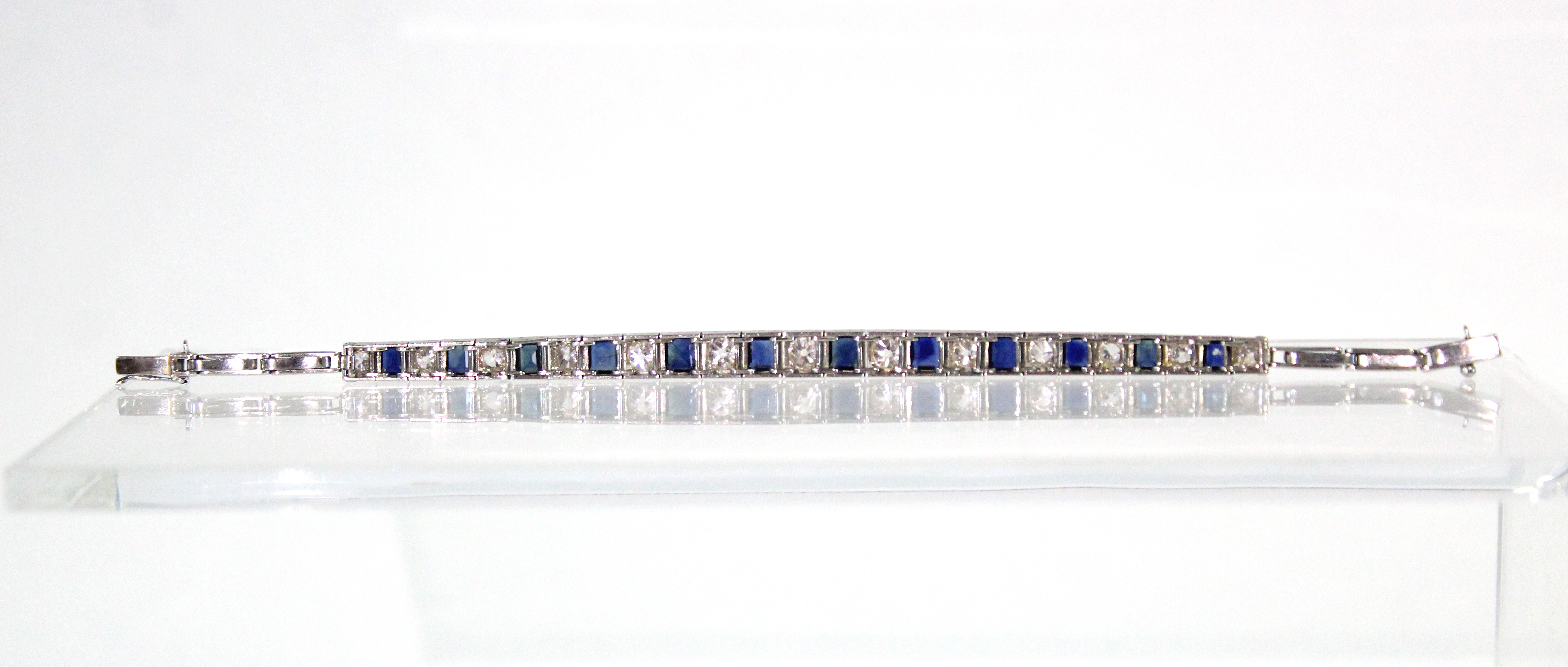 AN ART DECO PLATINUM, DIAMOND, & SAPPHIRE EXPANDING BRACELET, the thirteen graduated pavé-set - Image 3 of 7