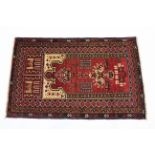 A Baluchi rug of dark blue ground with central geometric & architectural designs; 36” x 37”.