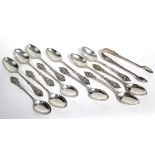 A set of twelve Victorian silver teaspoons & matching sugar tongs with fancy cast & pierced floral