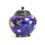 A late 19th century Chinese cloisonné squat round vase & cover with all-over decoration of flowers &