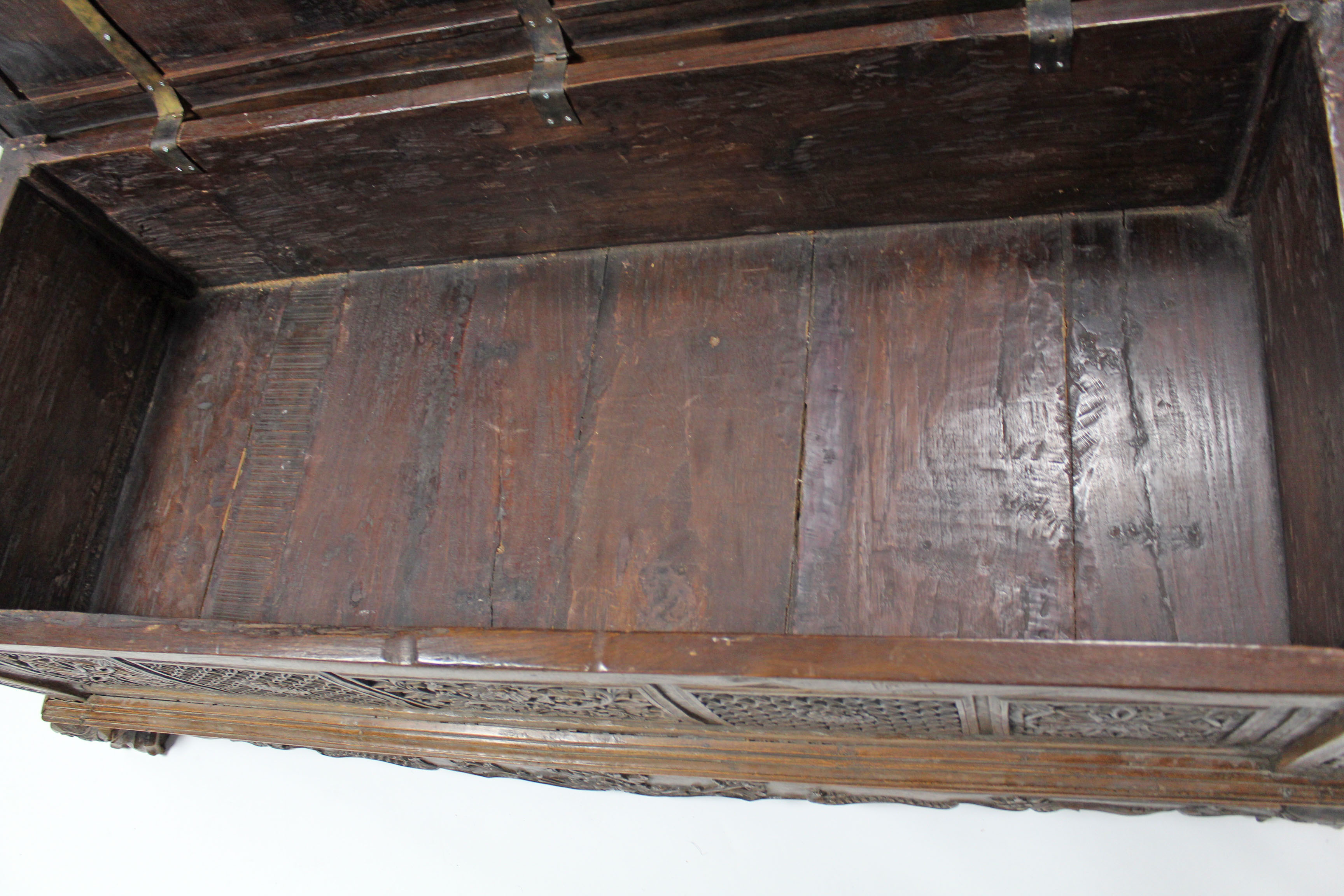 A 19th century INDONESIAN SOLID HARDWOOD CHEST, profusely carved to all sides with floral & - Image 4 of 11