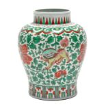 A CHINESE PORCELAIN BALUSTER VASE, decorated in famille-verte enamels with lion-dogs, peonies, &