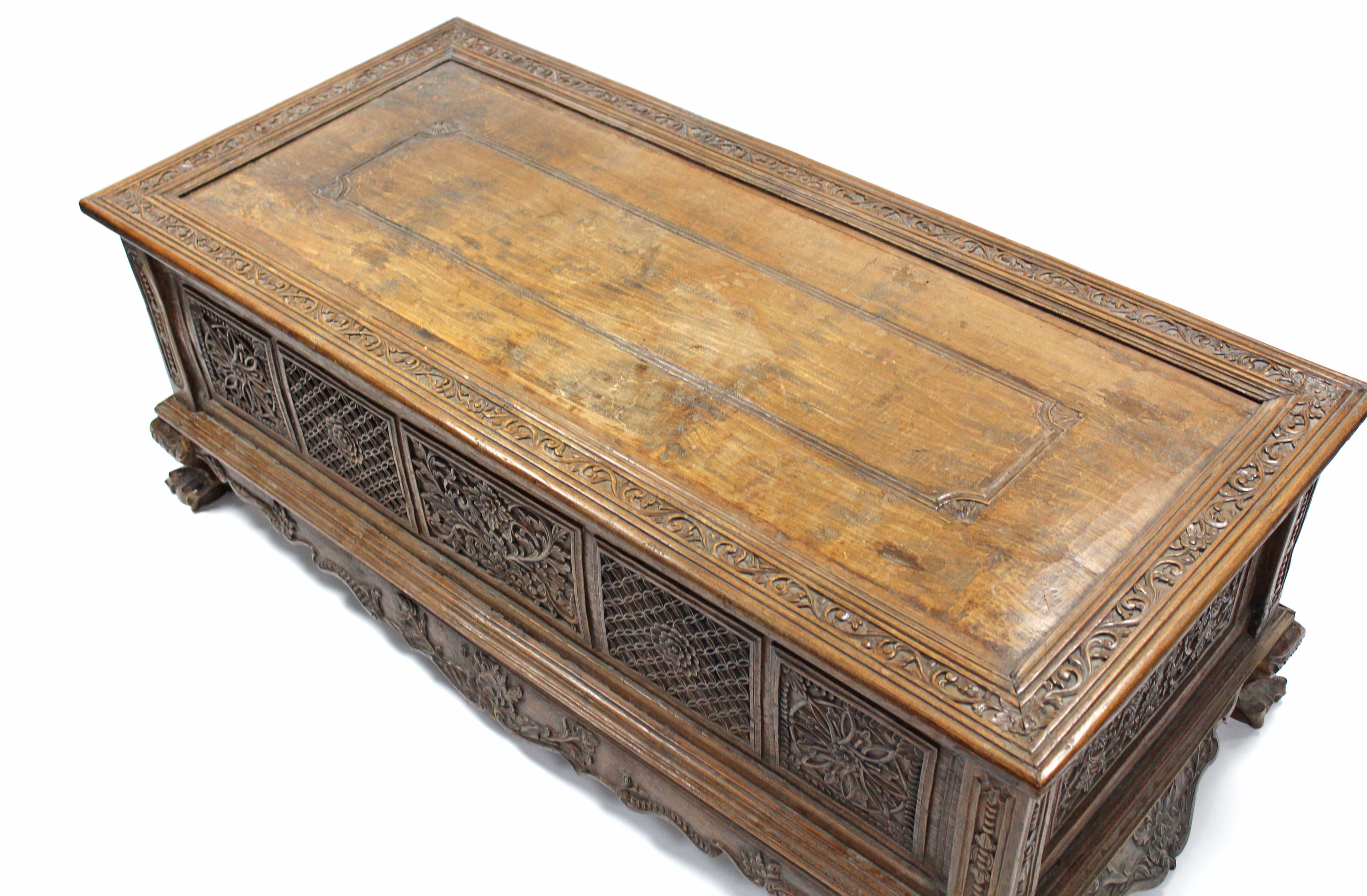 A 19th century INDONESIAN SOLID HARDWOOD CHEST, profusely carved to all sides with floral & - Image 2 of 11