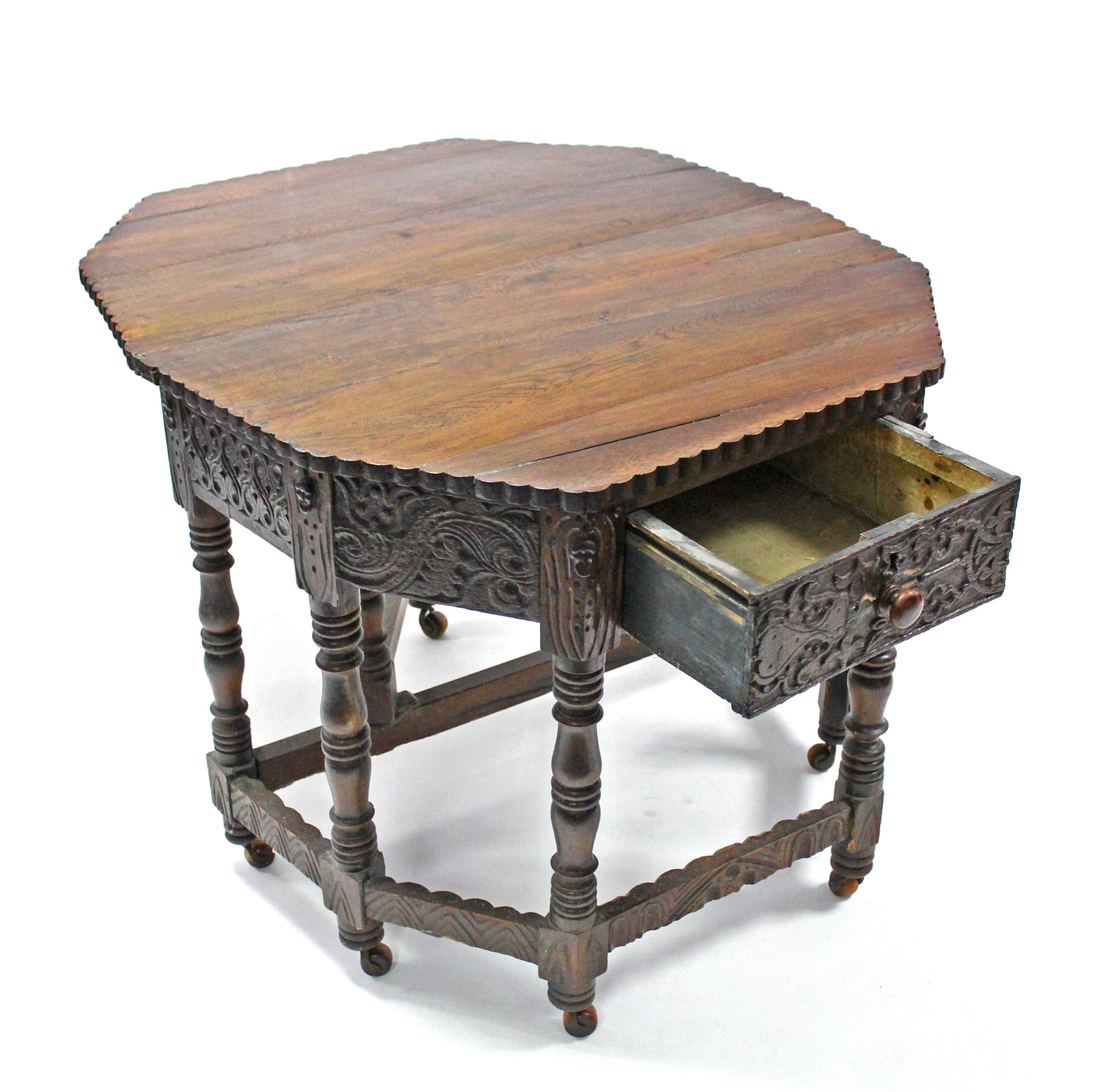 A 17th century-style carved oak credence table with fold-over top, shaped edge, fitted frieze - Image 3 of 4