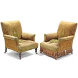 A pair of Victorian armchairs by Cornelius V. Smith, London, with sprung seats, padded backs & arms