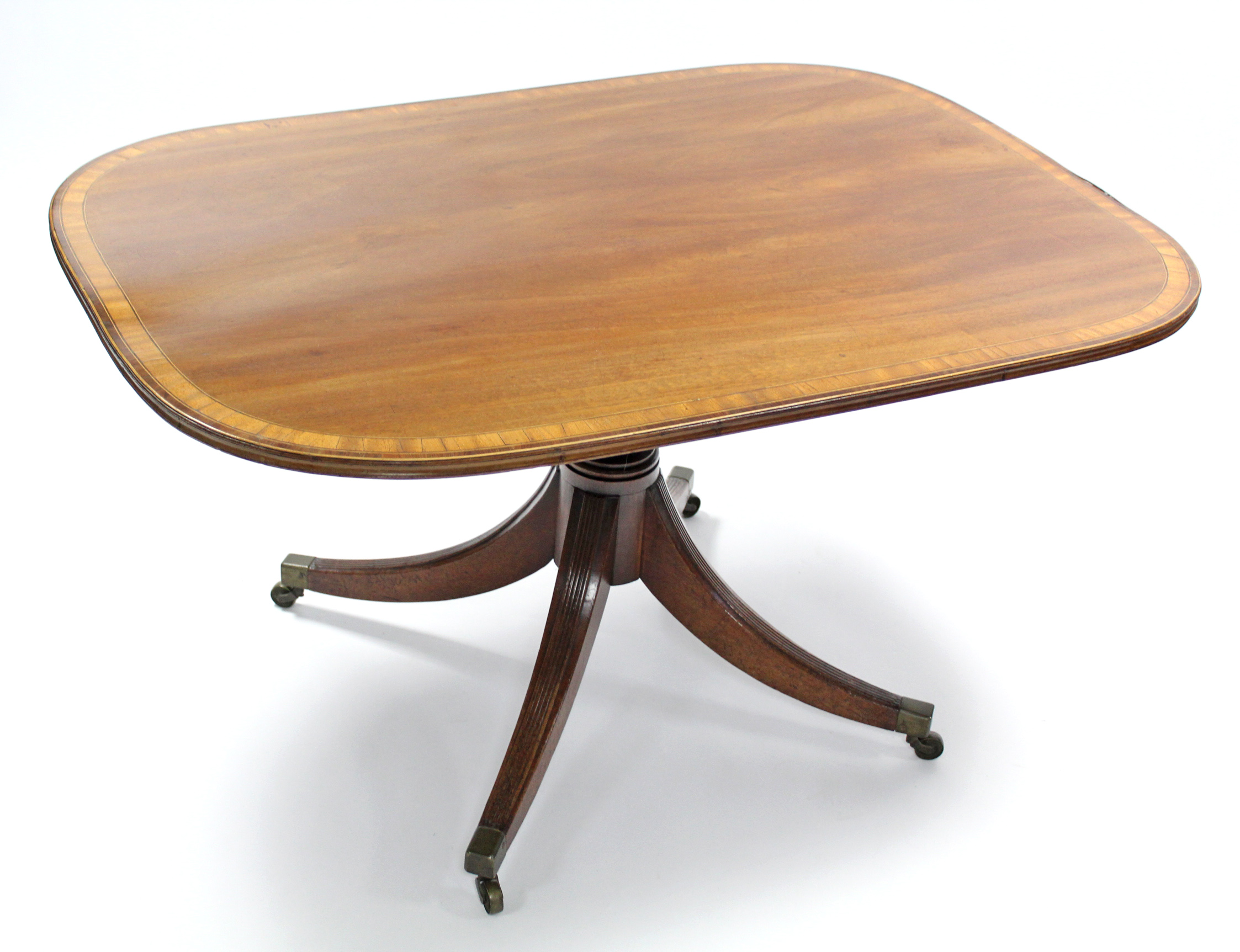 A Regency mahogany & satinwood-crossbanded breakfast table with rectangular tilt-top on turned