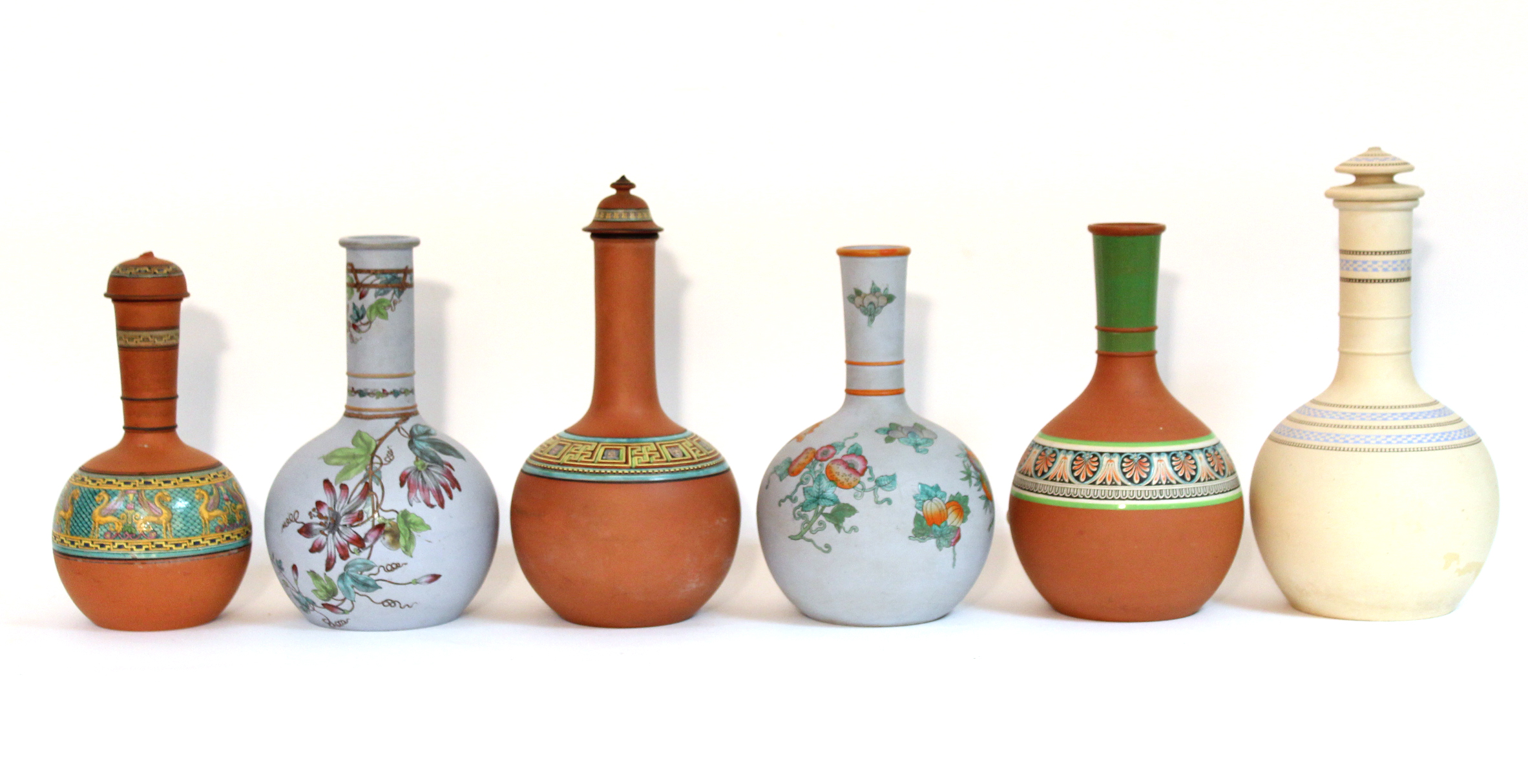 Six various terracotta bottle vases with floral & classical decoration, w.a.f.