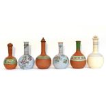 Six various terracotta bottle vases with floral & classical decoration, w.a.f.