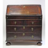 A WILLIAM & MARY OAK BUREAU, the sloping fall front with book-rest enclosing a fitted interior