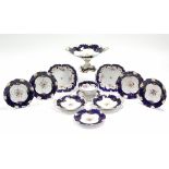 A 19th century English porcelain part dessert service comprising a comport & eleven various