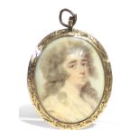 A late 18th century portrait miniature of a young woman with long curled hair; on ivory, 1½” x