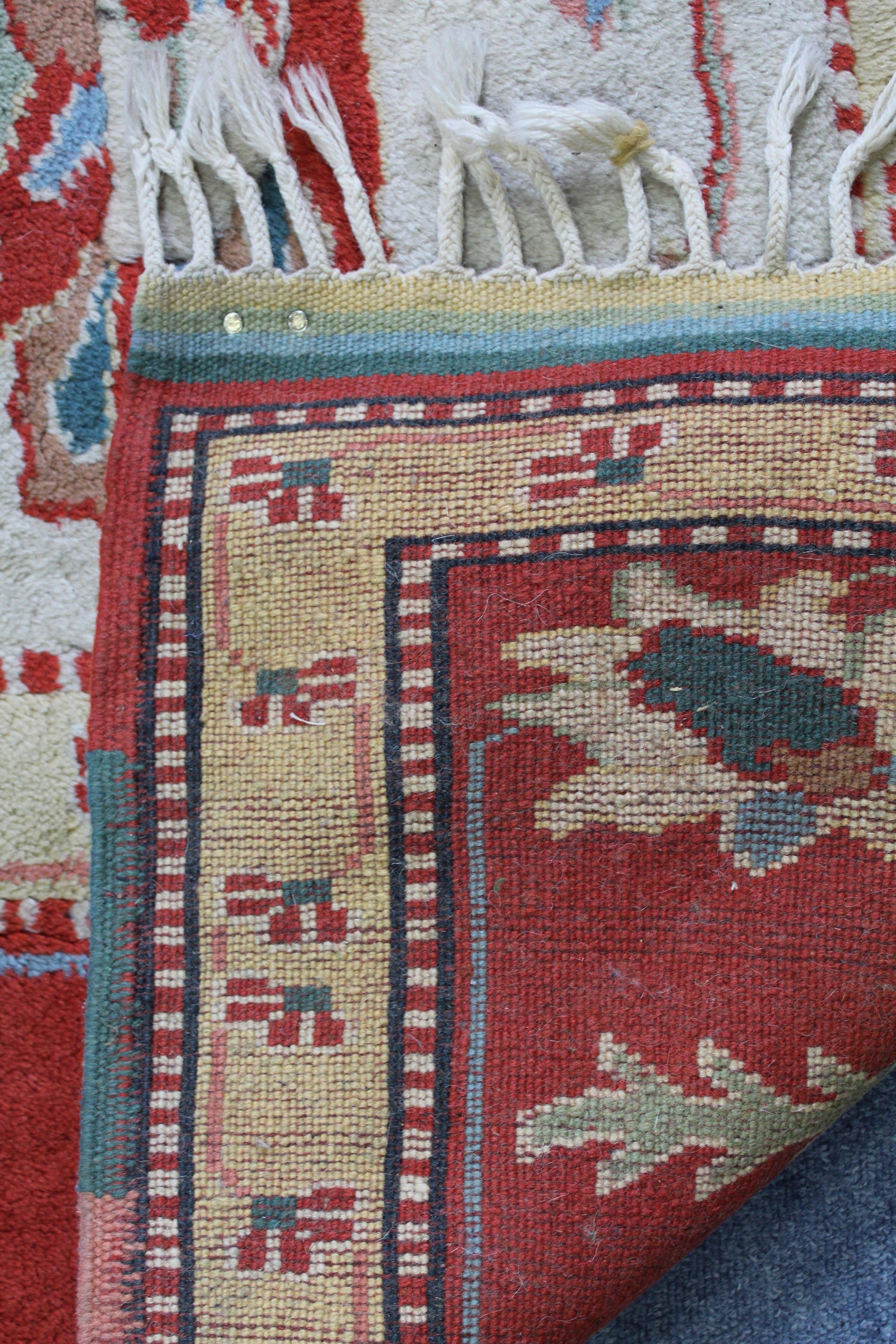 A Turkish Konya rug of ivory ground, with central foliate design within a rust-red border; 74” x - Image 3 of 3