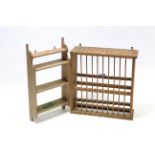 A pine wall-mounted plate-rack, 28¾” wide x 24½” high; & a set of pine wall shelves, 29” wide x 15½”