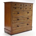 A VICTORIAN MAHOGANY CHEST fitted with an arrangement of four short & three long graduated drawers