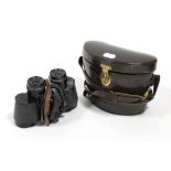 A pair of Carl Zeiss 8 x 30 mm binoculars with leather case.
