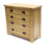A light oak chest, fitted two short & three long graduated drawers with iron swing handles, 39” wide