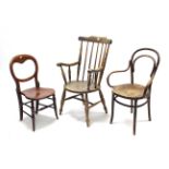 A cottage spindle-back elbow dining chair; a bentwood elbow chair; & an occasional chair.