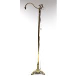 An Edwardian-style brass standard lamp with scroll arm, & on round centre column & triform base,