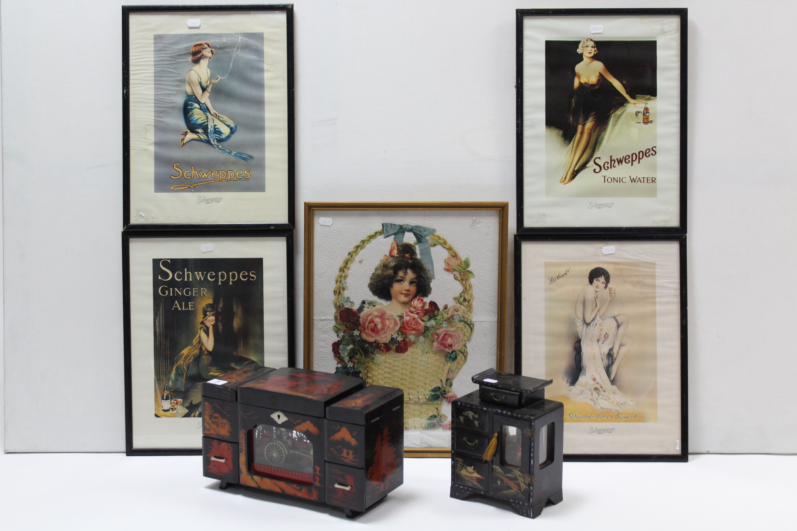 Two black lacquered jewellery cabinets; five reproduction “Schweppes” coloured prints; & a scrap
